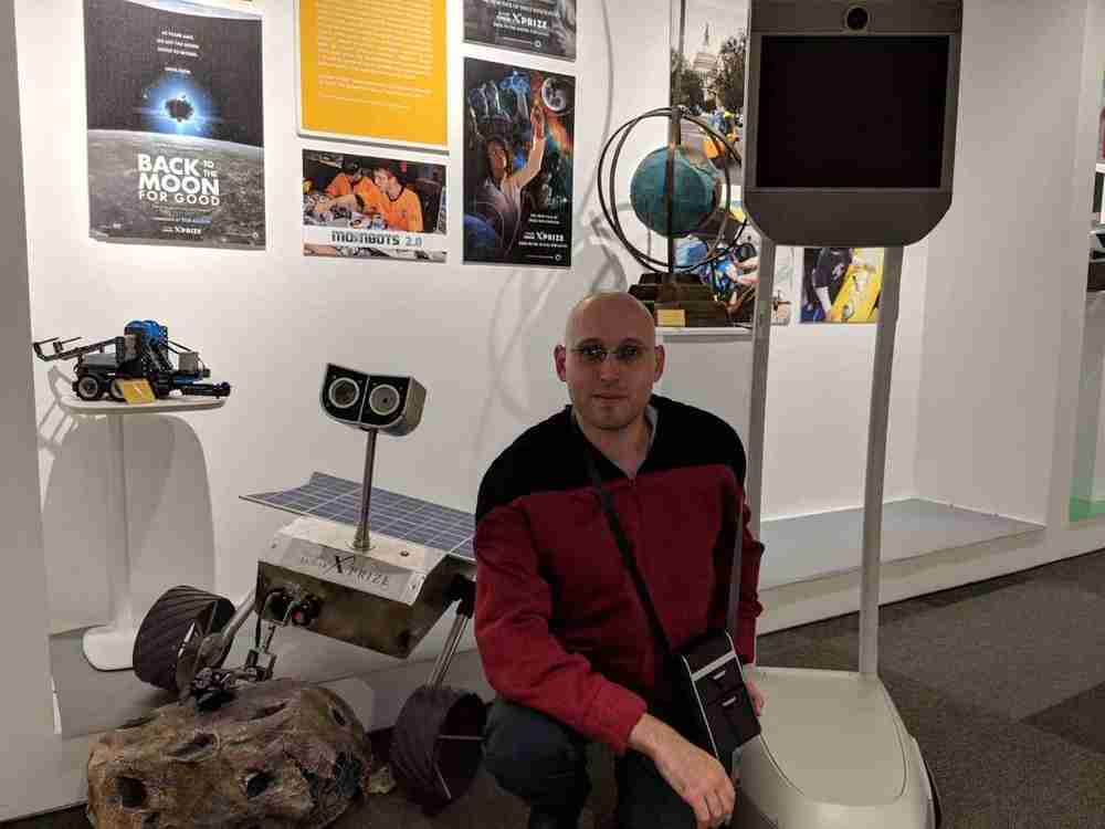 Dr. Roey Tzezana with robotics exhibits at XPRIZE